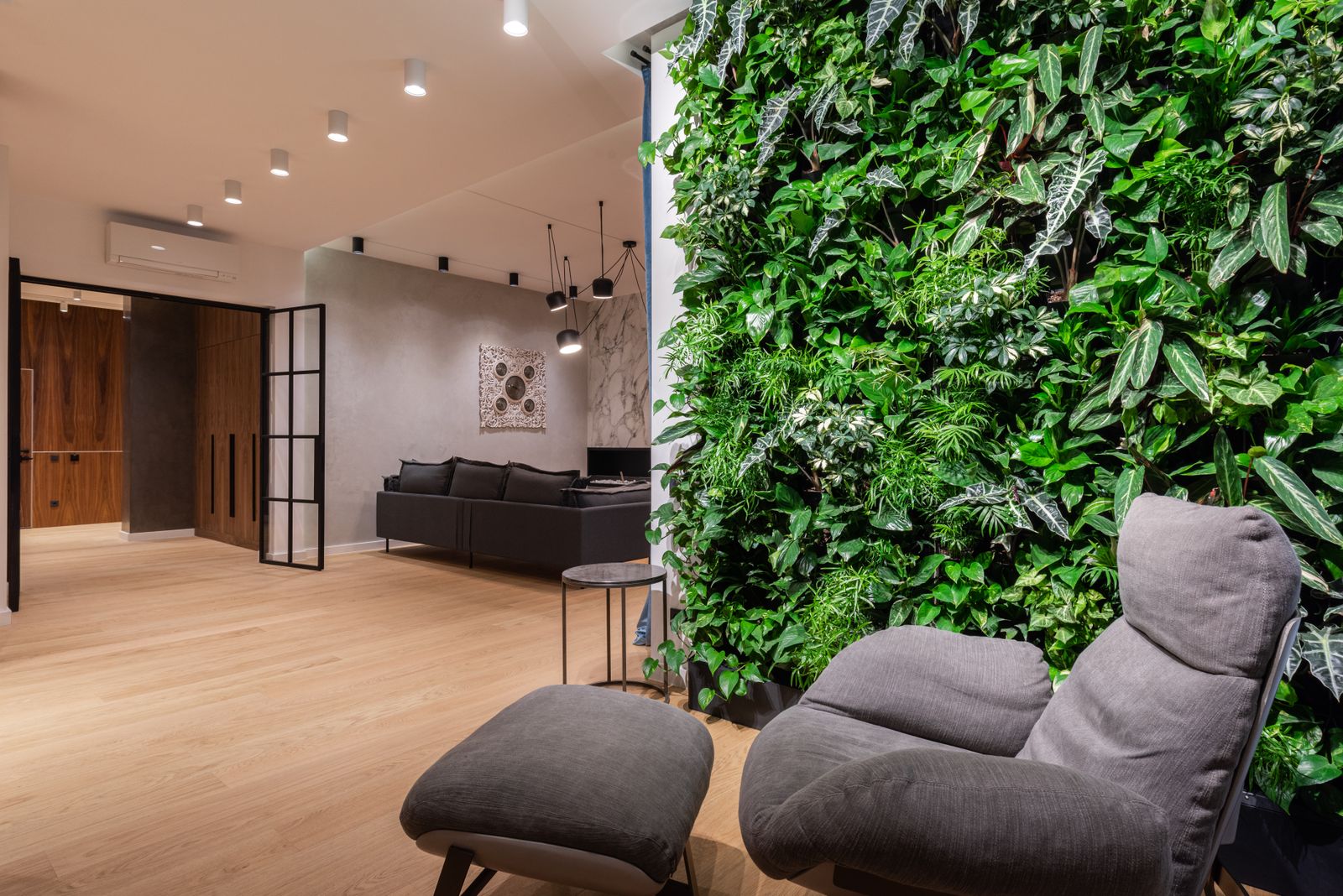 Dark green painted ceiling as the fifth wall in a moody sunroom
