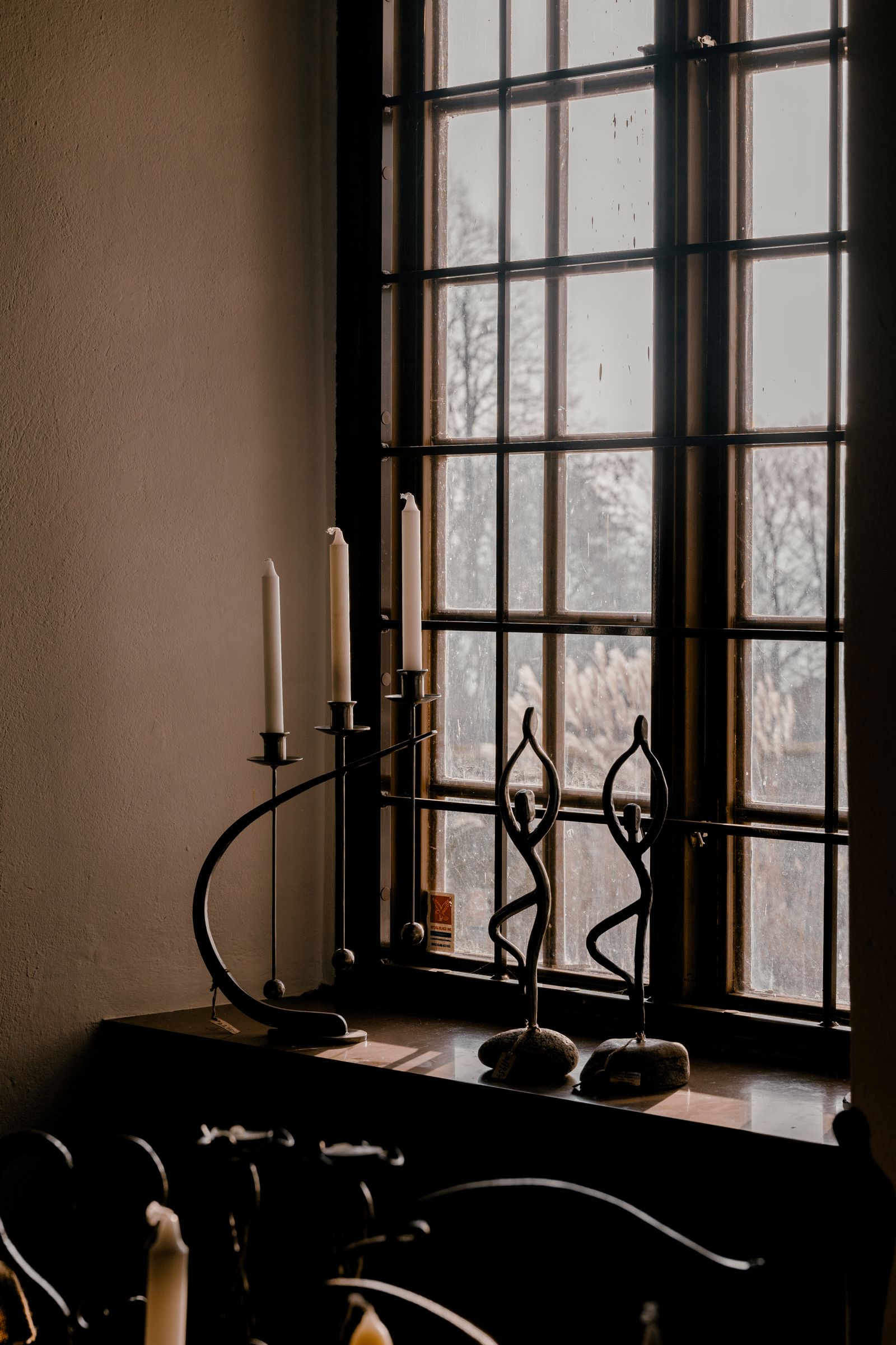 Black and brass lanterns for after-dark sunroom ambiance